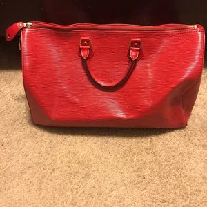 Authentic Red Louis Vuitton speedy bag.